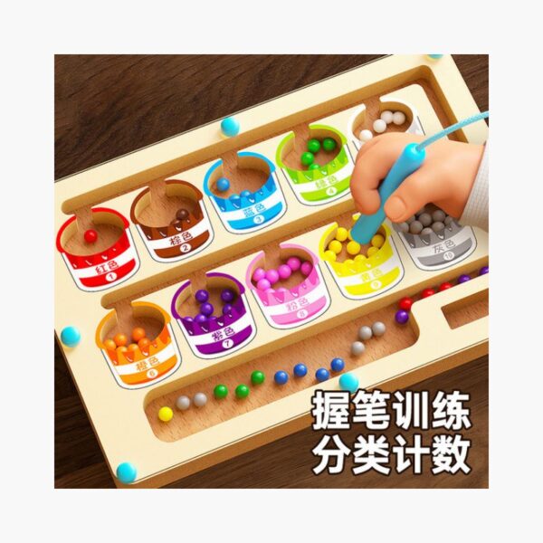Close-up of colorful magnetic balls being moved through the number maze – preschool educational toy
