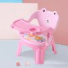 Baby sitting in feeding high chair eating comfortably